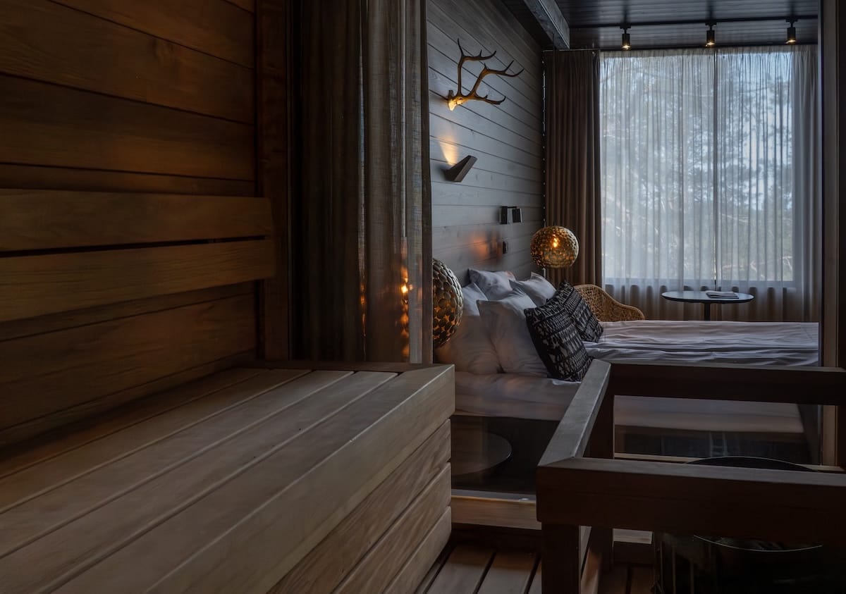 The view from inside a sauna that looks into the bedroom